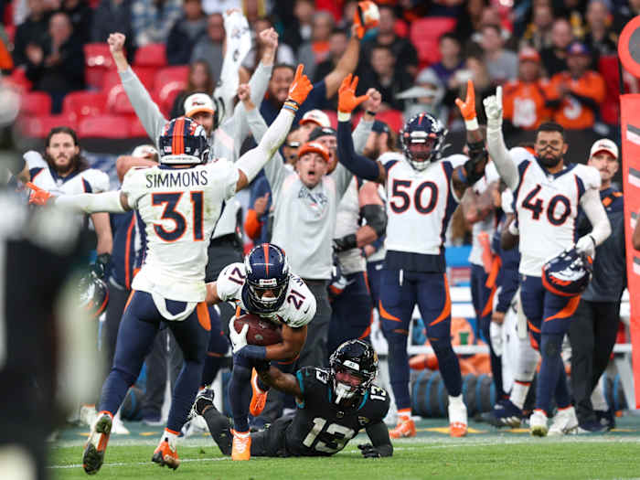 Denver Broncos cornerback KWaun Williams (21) intercepted the ball from Jacksonville Jaguars quarterback Trevor Lawrence (16) (not pictured) in the fourth quarter during an NFL International Series game at Wembley Stadium.